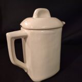 Old covered jug, vintage, geometric frieze with flowers and black trim.