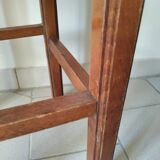 Antique campaign stool in solid wood with a straw seat.