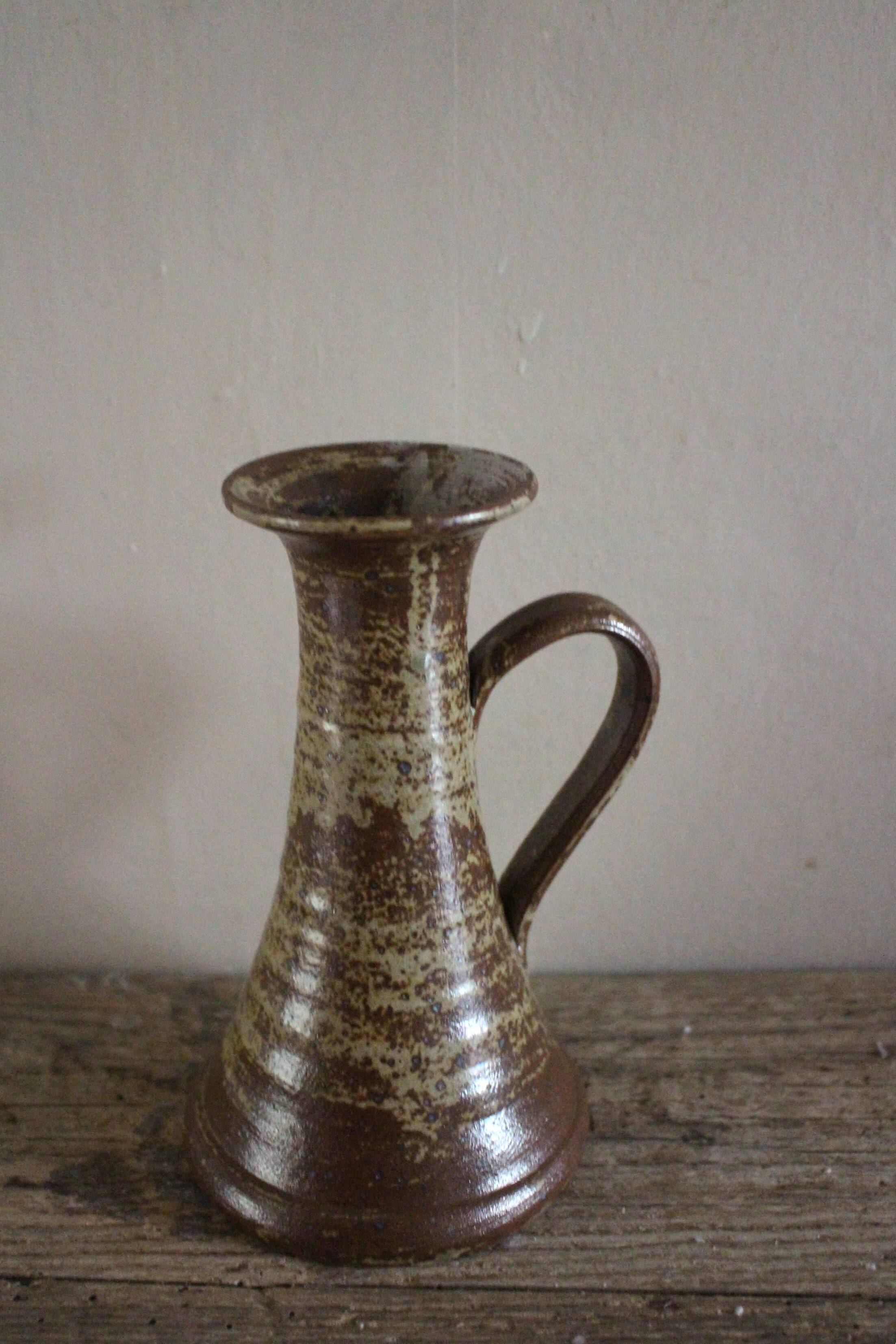 Vintage pyrite-glazed stoneware candlestick with handle