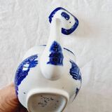 Small porcelain teapot or milk jug with the famous blue willow or weeping pattern