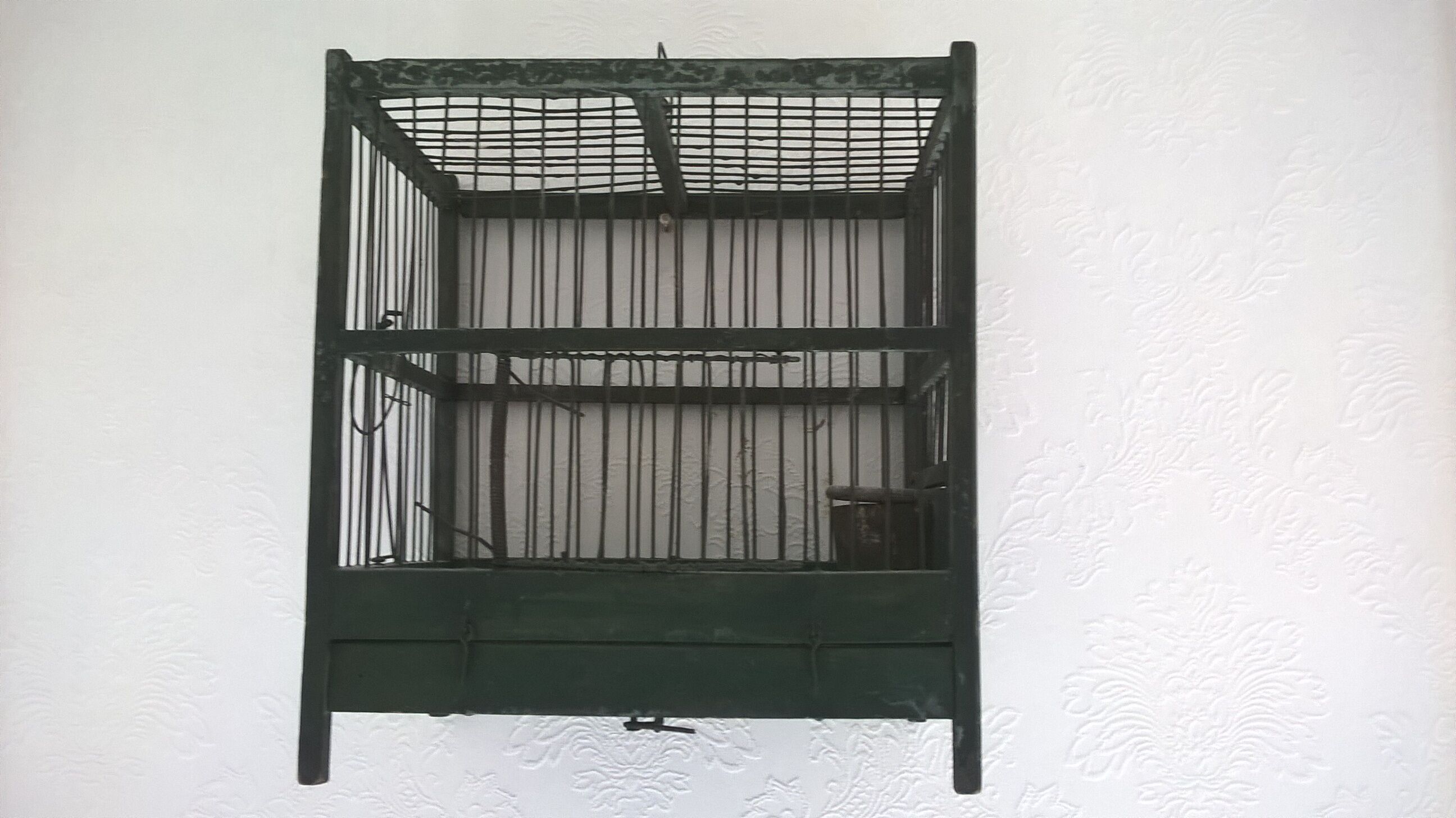 Wooden bird cage with feeder