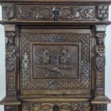 Renaissance-style cabinet in solid oak decorated with chimeras and caryatids