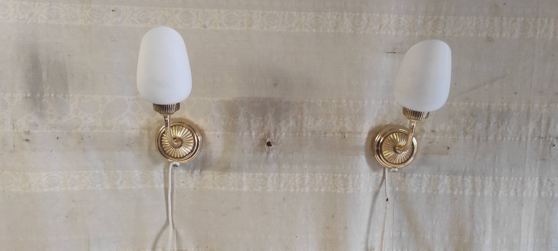 Articulated brass and opaline wall lights - mid 20th century.