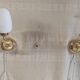 Articulated brass and opaline wall lights - mid 20th century.