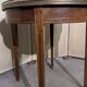 Bouillotte table in Louis XVI style with marquetry and gilded brass inlays.