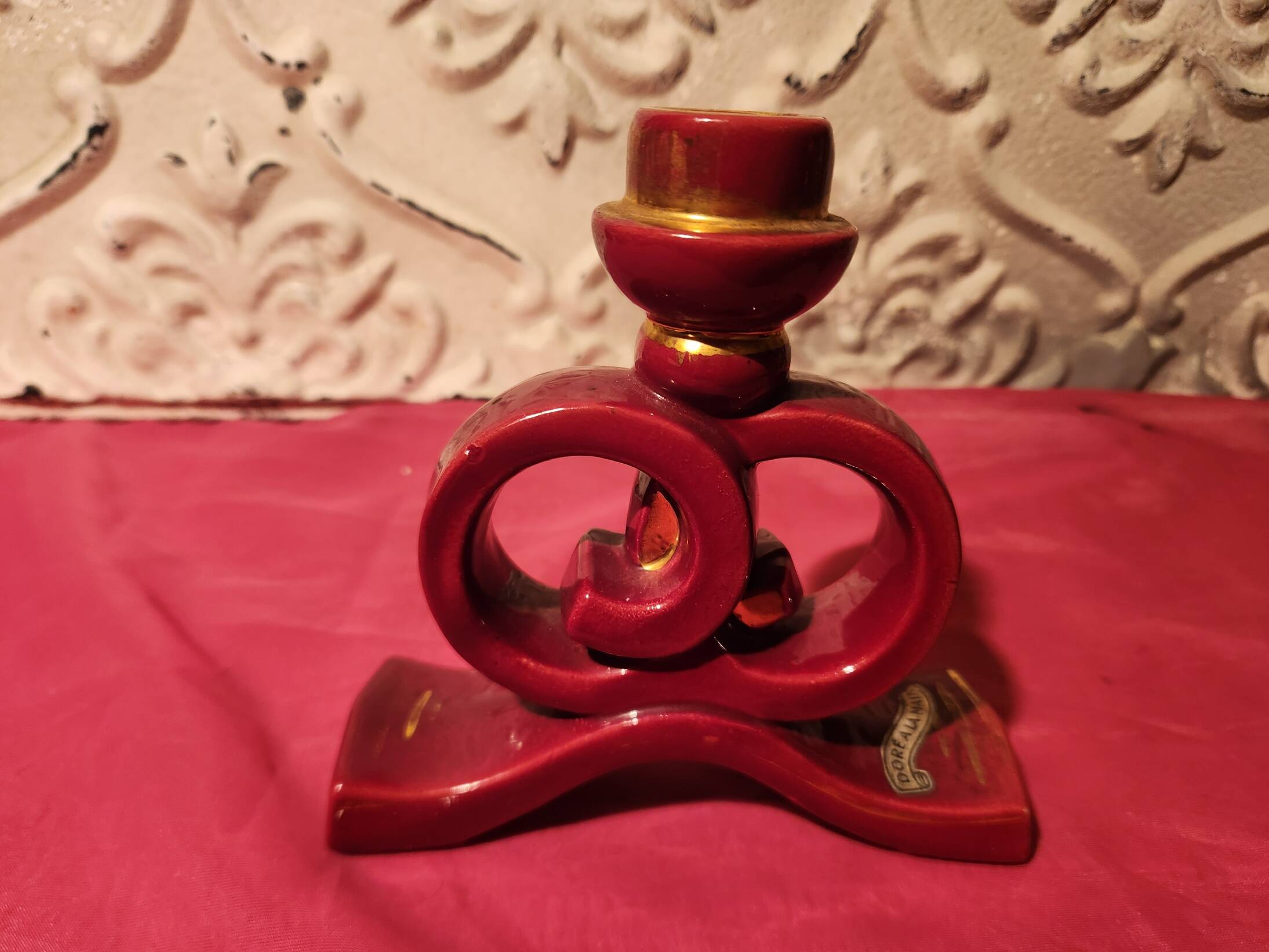 Pair of vintage ceramic candle holders, hand-painted in red and gold.