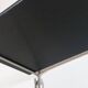 Mid-century vintage shelf in a loop shape, black glass and metal.