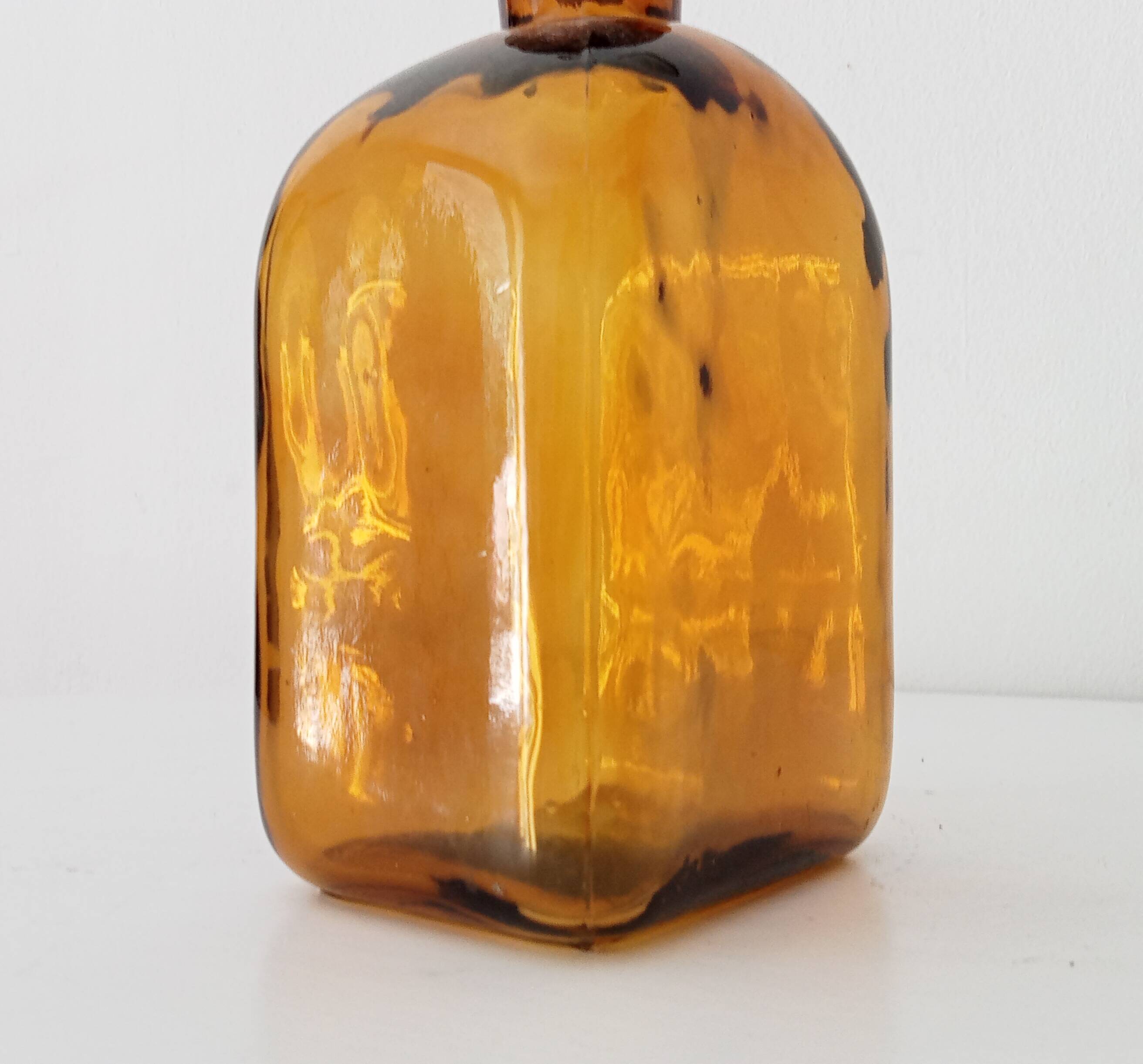 Vintage amber glass apothecary bottle