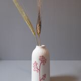 Porcelain vase and biscuit decorated with flowers