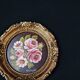 Still life in Tondo oil on panel of a bouquet of pink roses signed