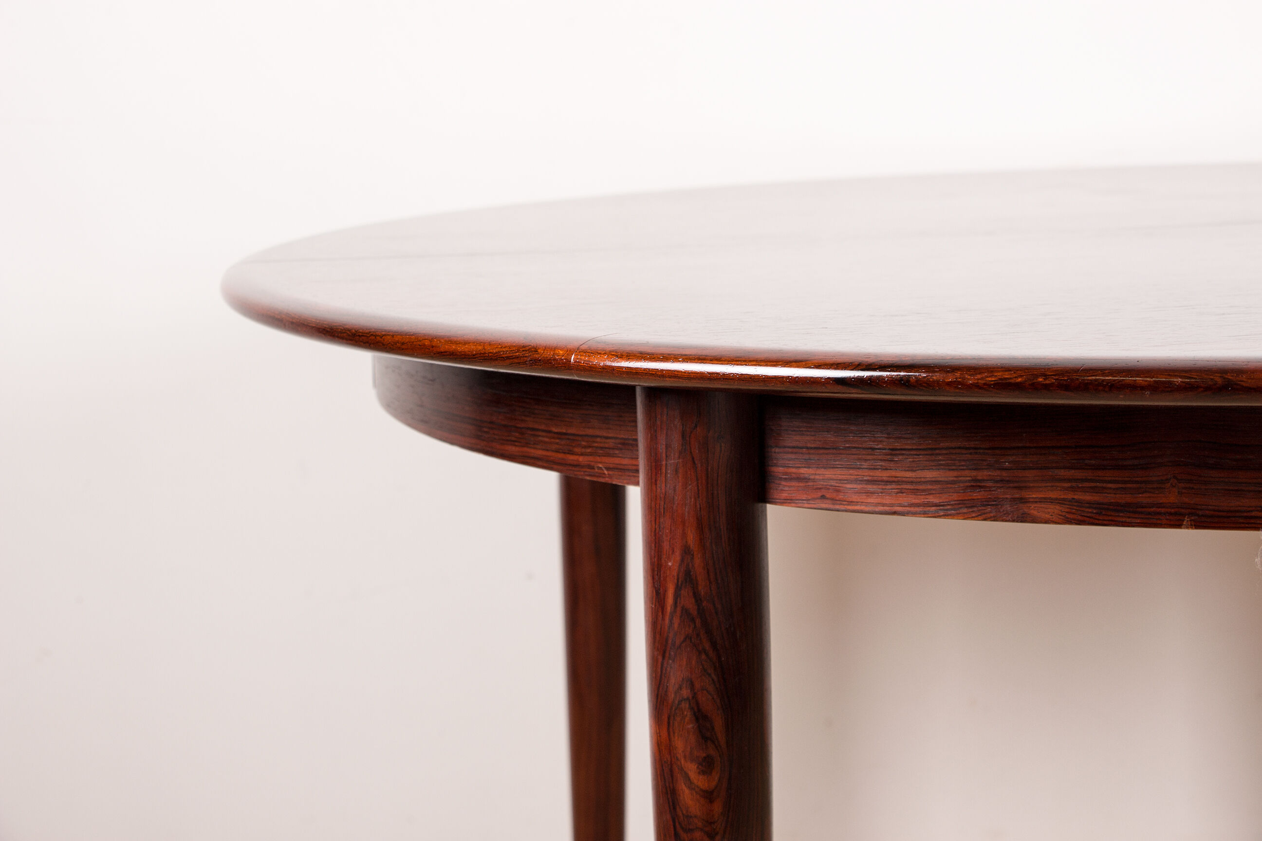 Danish extendable dining table in Rio Rosewood model 55 by Arne Vodder for Sibast 1958.
