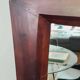 Grand miroir mural en bois exotique massif