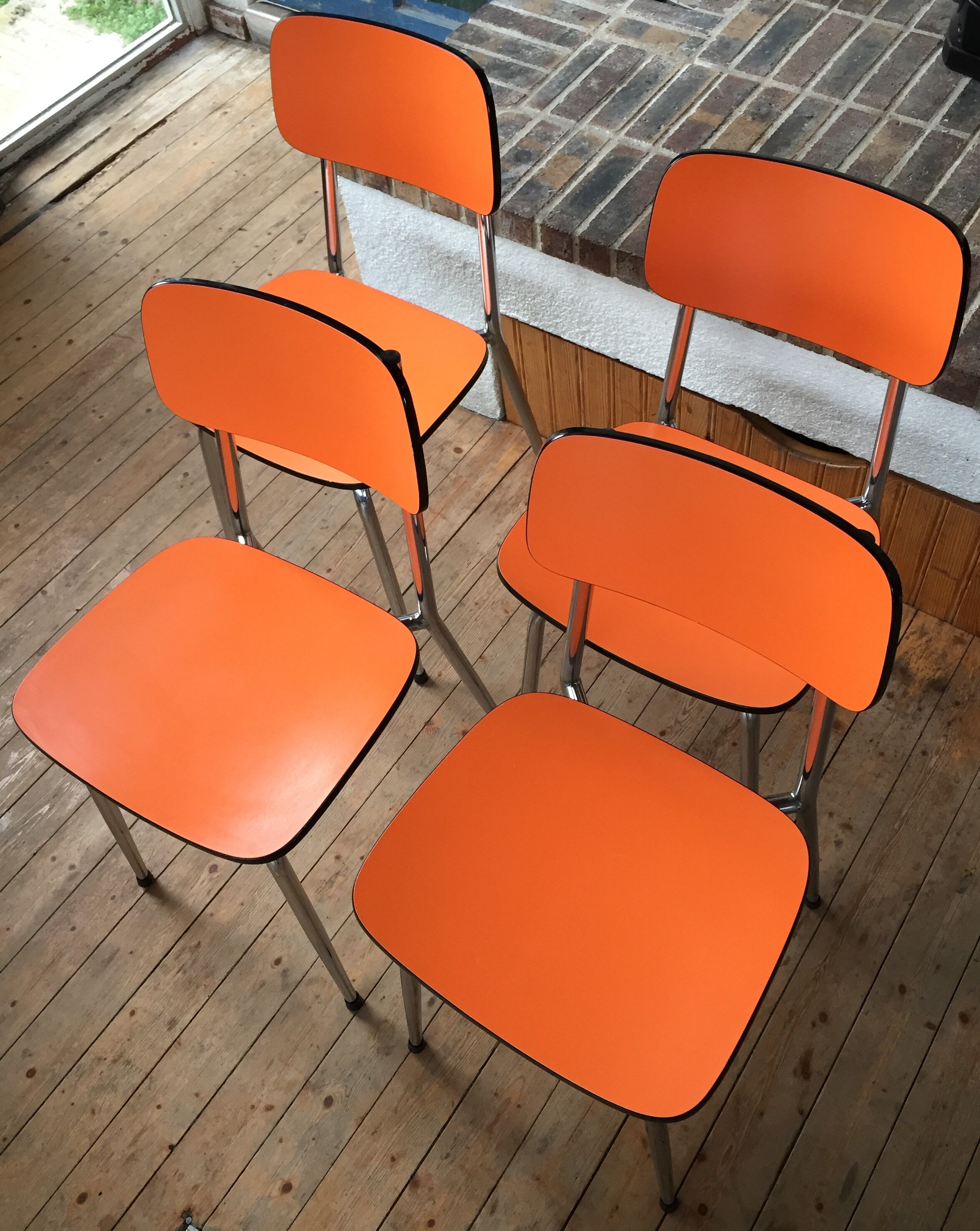 Lot of 4 vintage chairs in orange formica