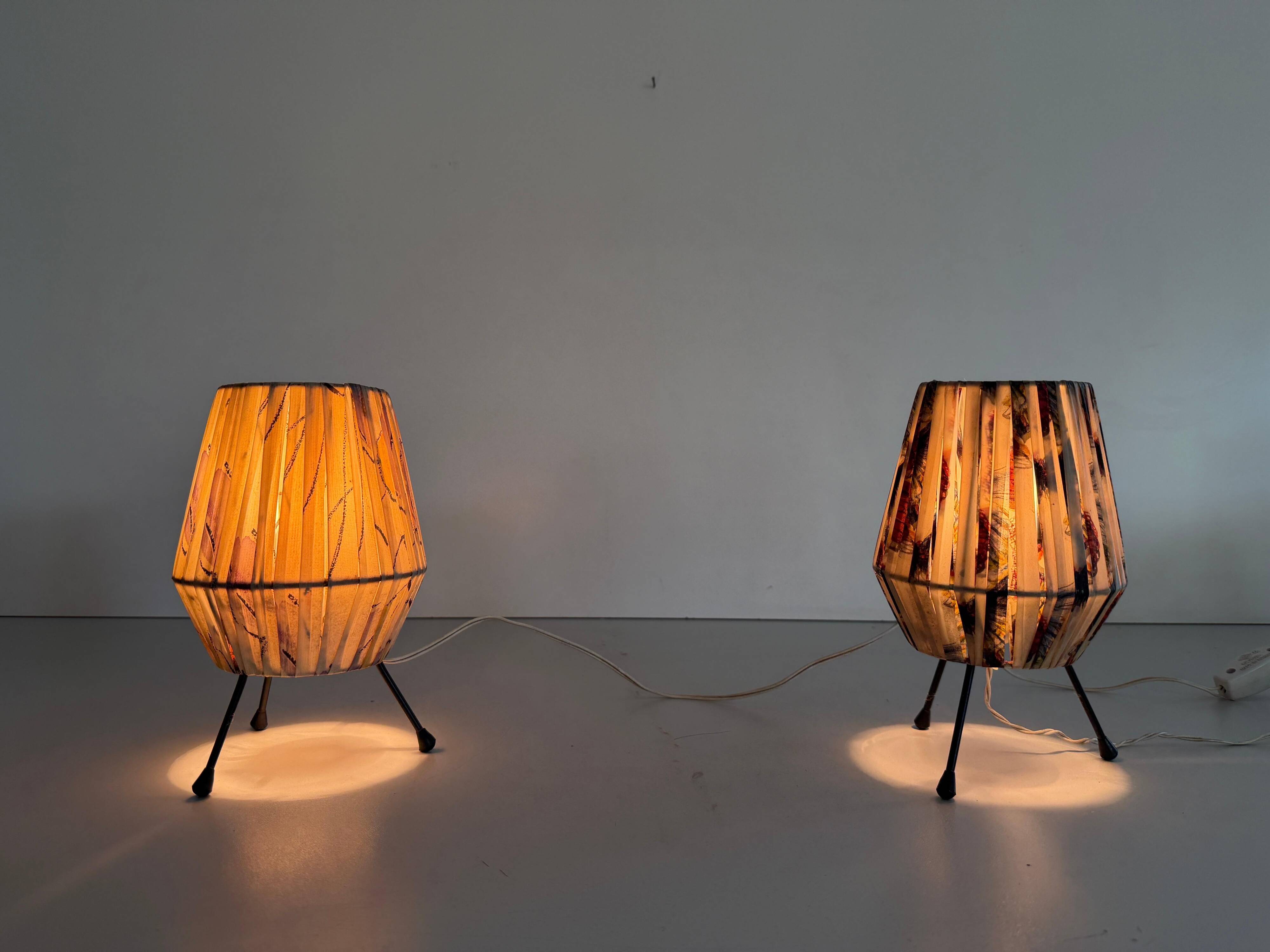 Pair of table lamps with plastic shades and tripod base, 1960s, Italy
