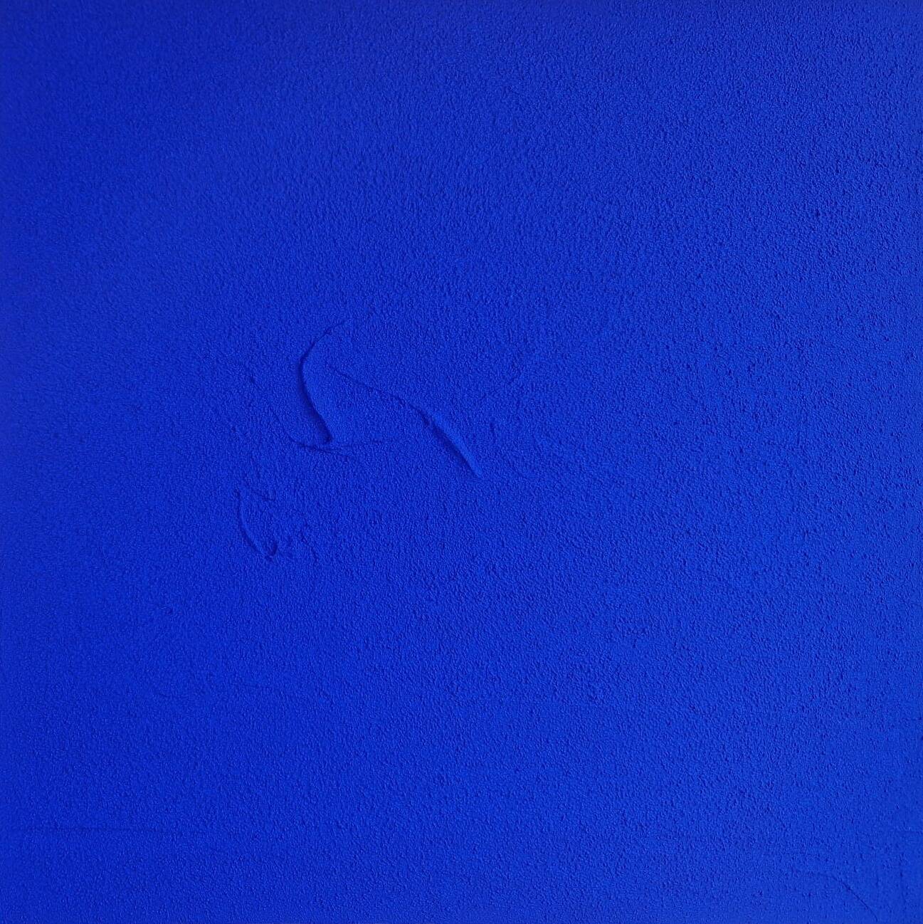 Framed monochrome blue abstract painting.