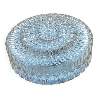 Large wall-mounted ceiling light with transparent glass.