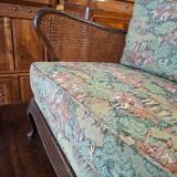 Antique English two-seater canapé, carved wooden frame.