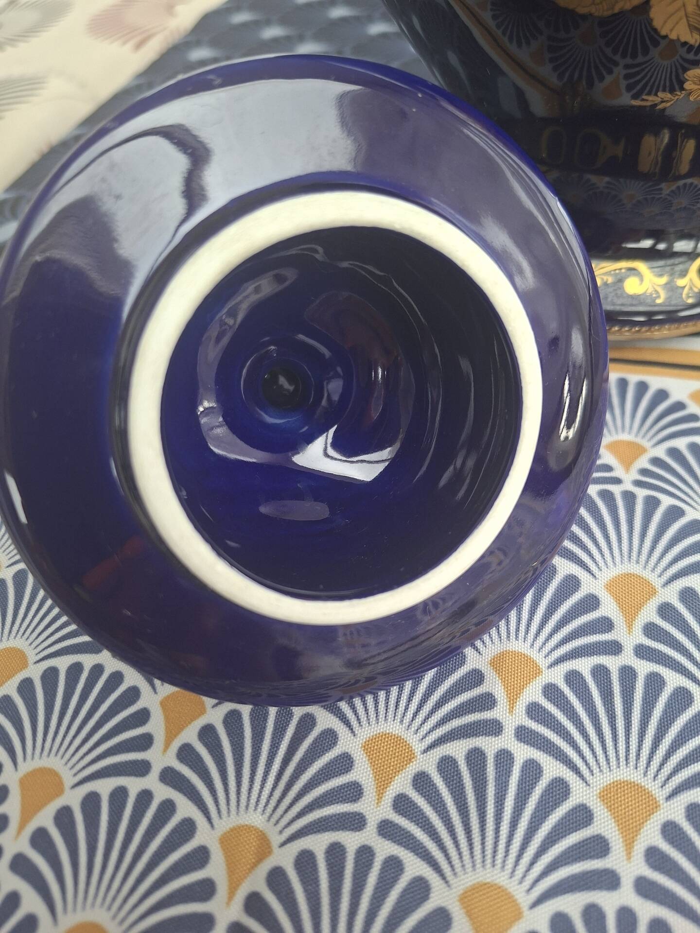Cobalt blue porcelain bonbonnière with gold decoration on feet.