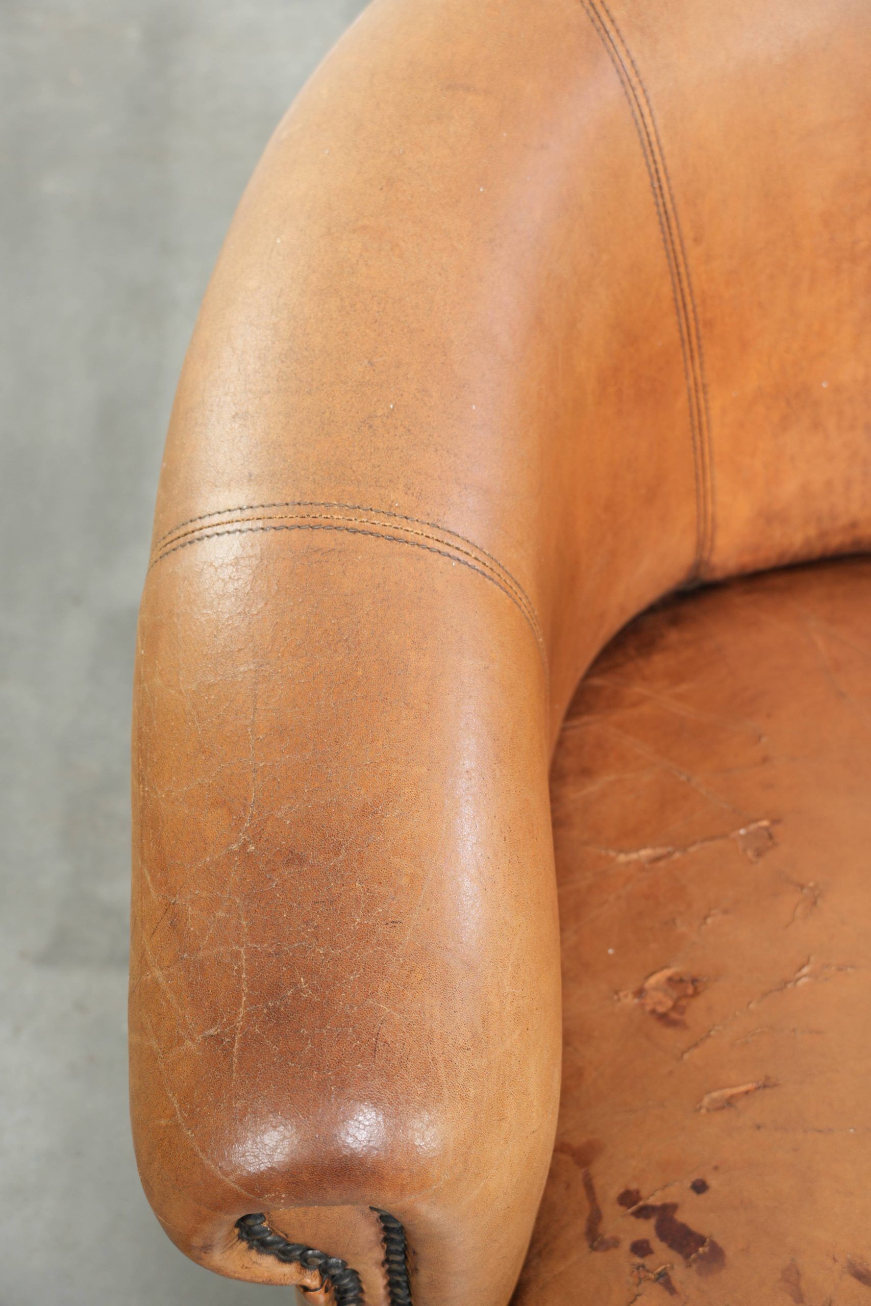 Set of two vintage sheepskin club armchairs with a beautiful light colour