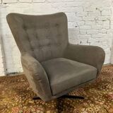 Swivel armchair in velvet fabric and metal