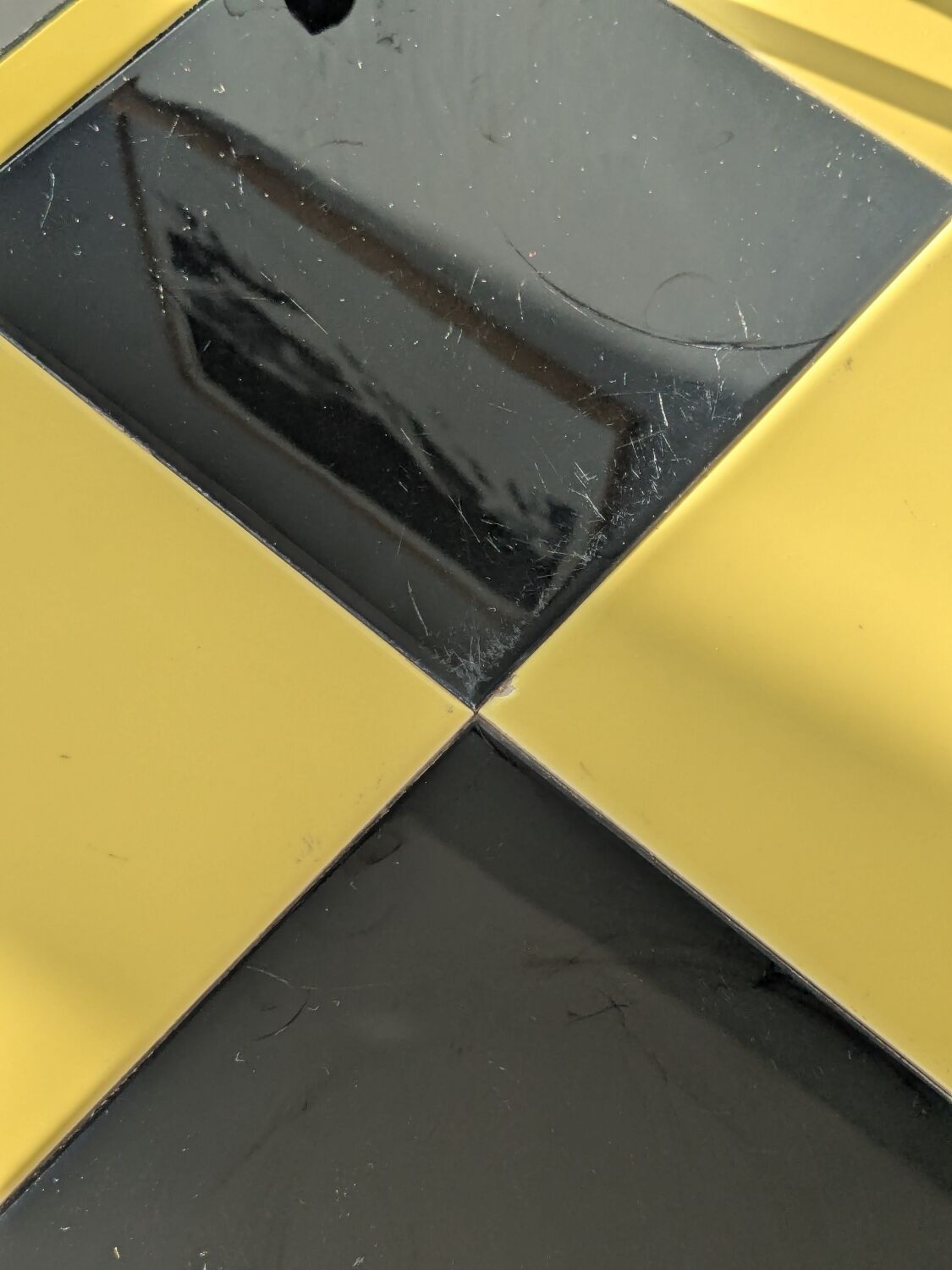 Vintage black and yellow checkered rolling bar trolley