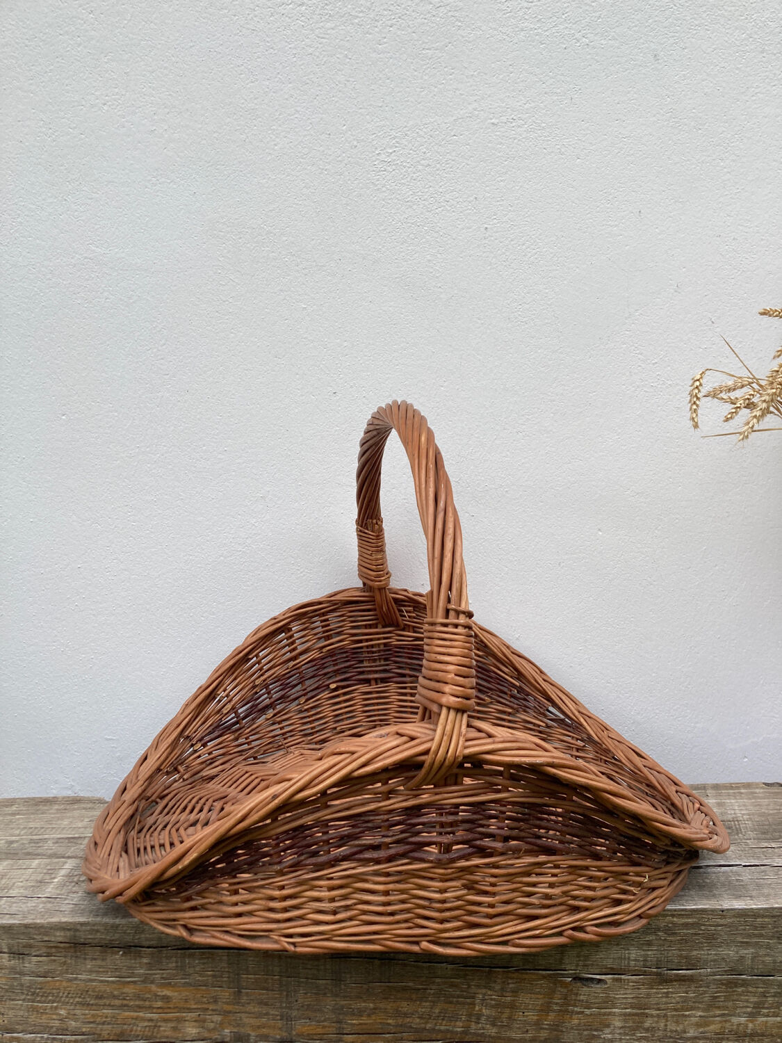 Large old woven wicker log basket