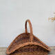Large old woven wicker log basket