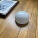 Small antique ceiling light or wall sconce with white opaline glass in a half-moon shape.