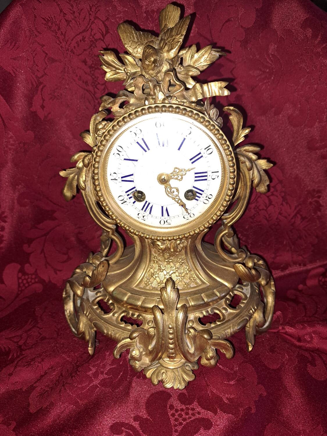 Clock, cartel in gilded bronze. Louis XV