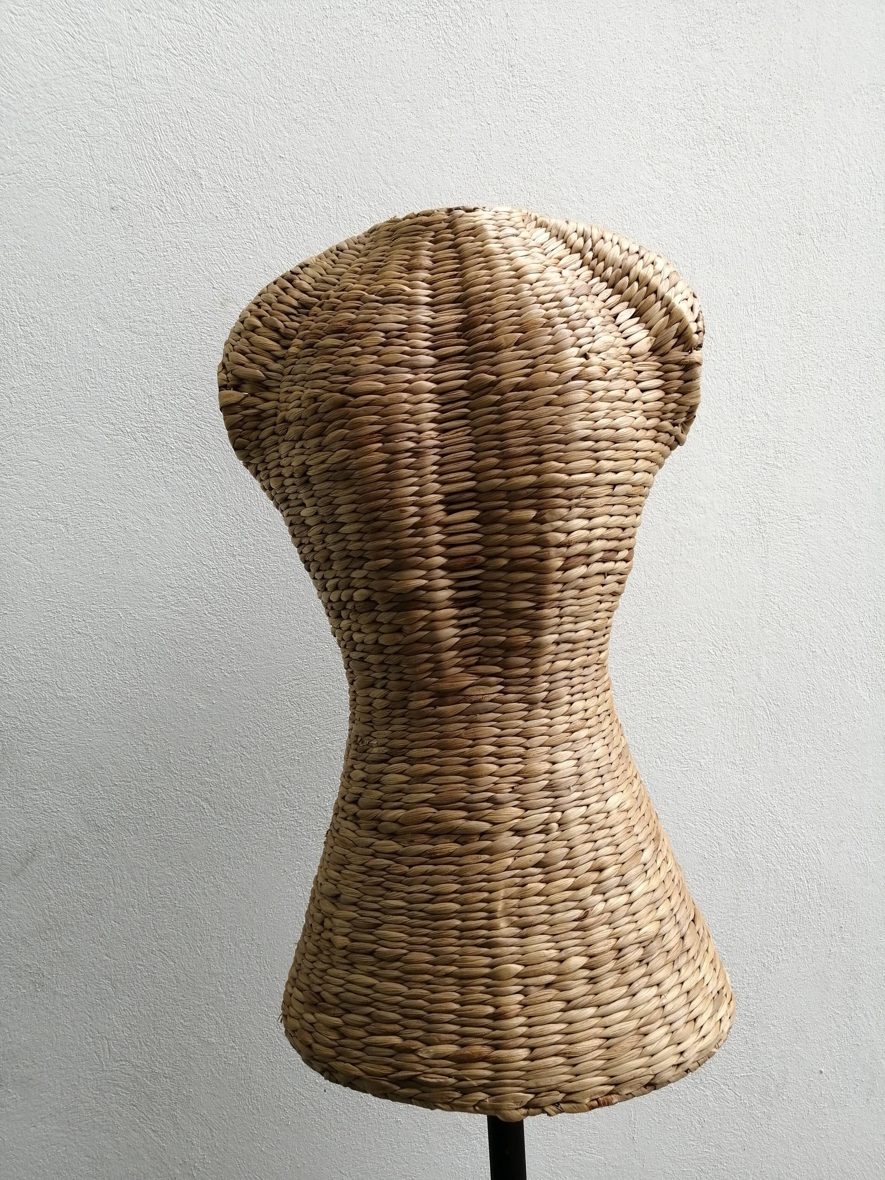 Model on a wicker stand.