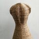 Model on a wicker stand.