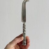 Antique shiny metal cheese cutlery
