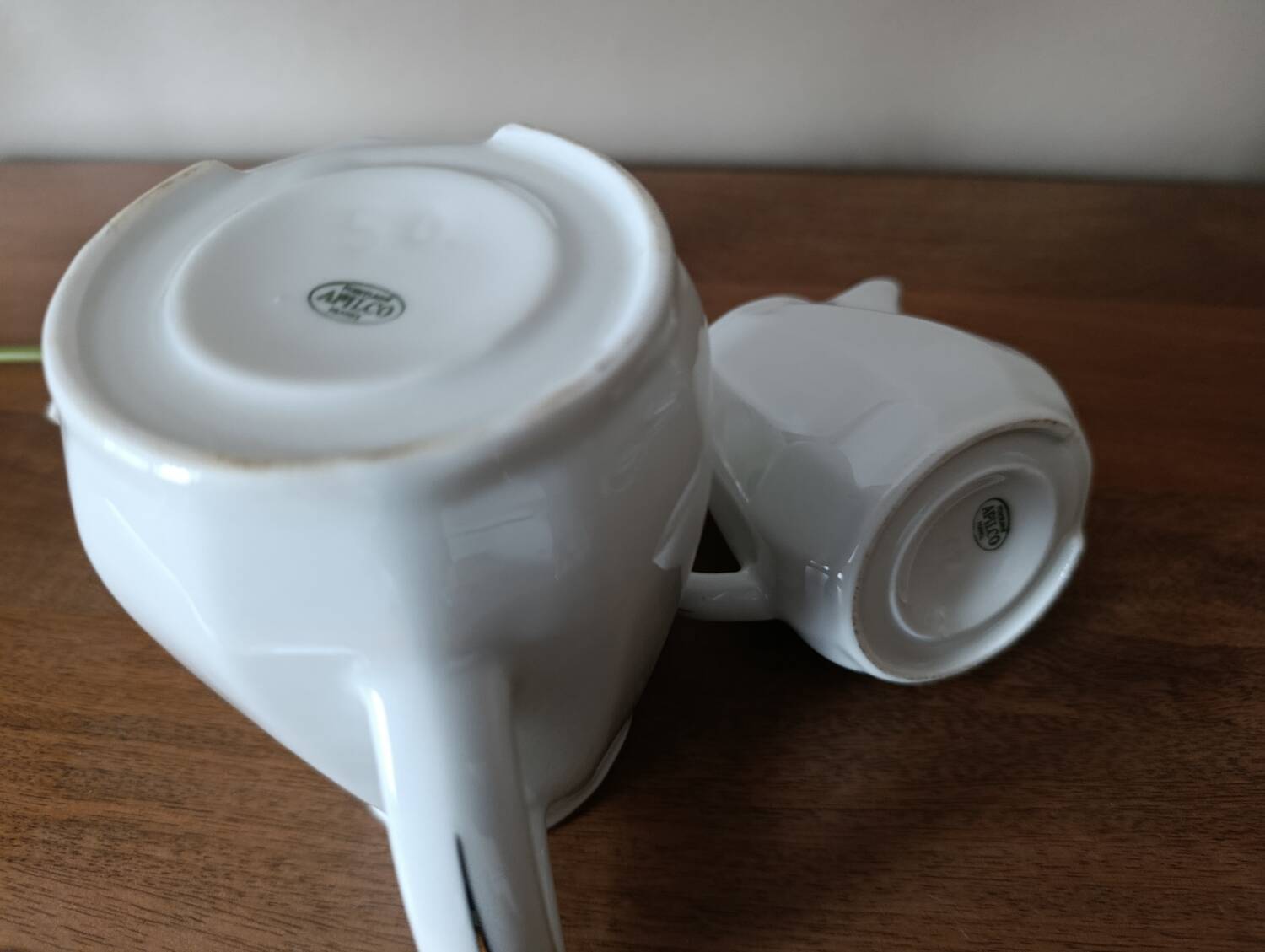 2 white porcelain milk jugs with platinum trim, Flora by Apilco.
