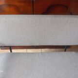 Two-seater sofa in fabric, metal and wooden armrests