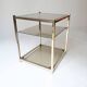 vintage coffee table design 1960s 1970s in gold metal and smoked glass
