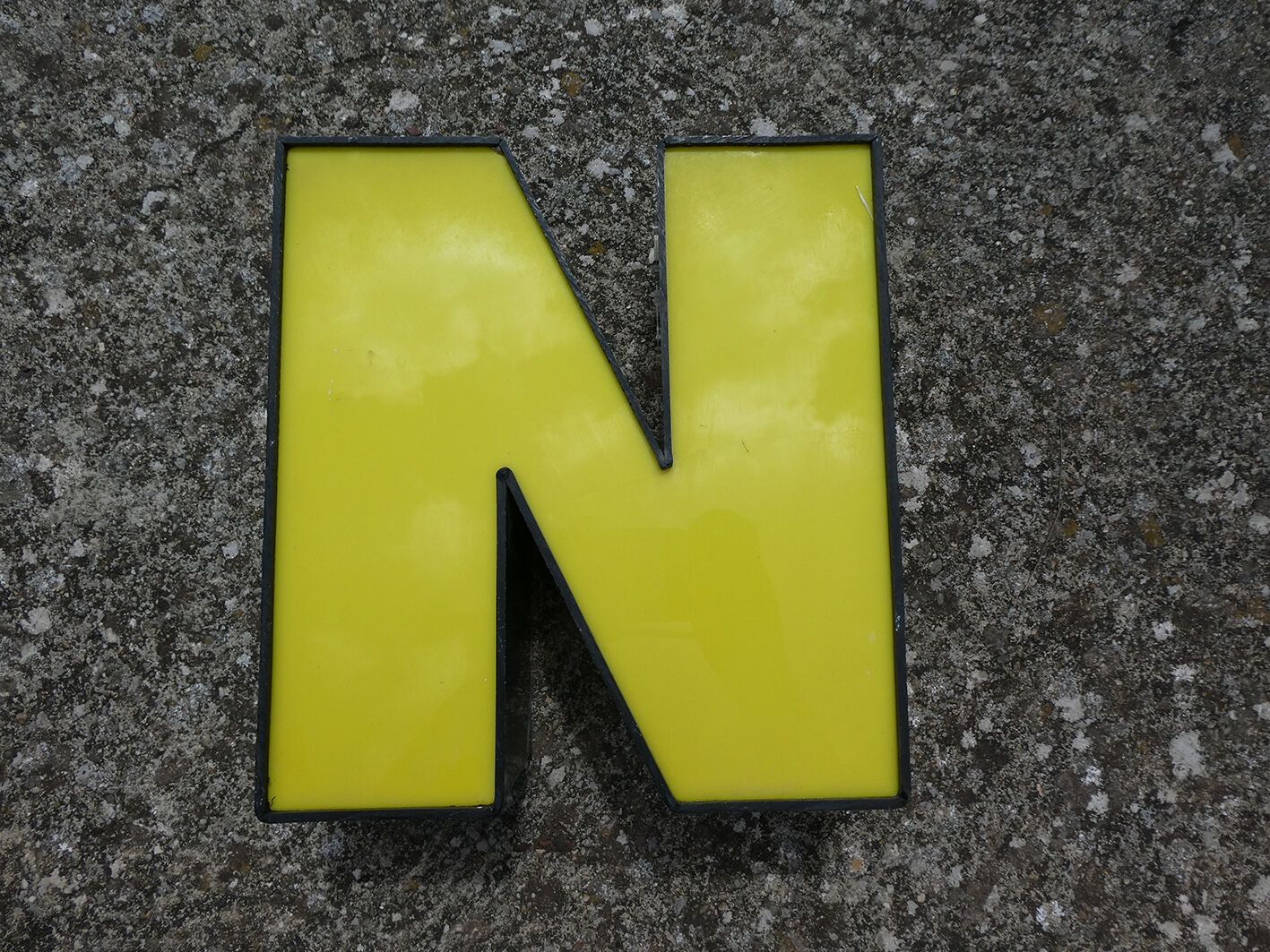 Yellow and black industrial sign letter "N"