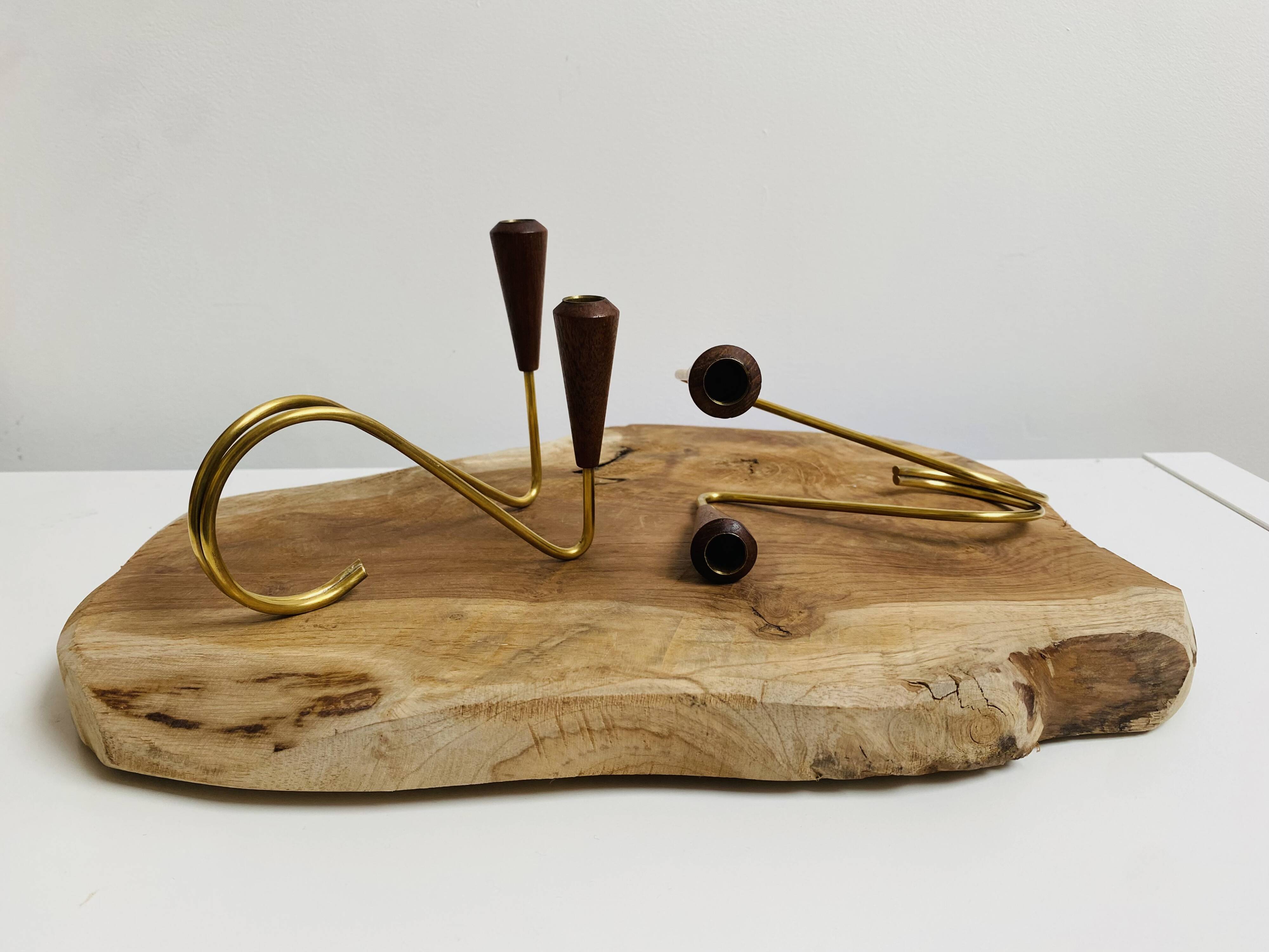 Pair of teak and brass candlesticks