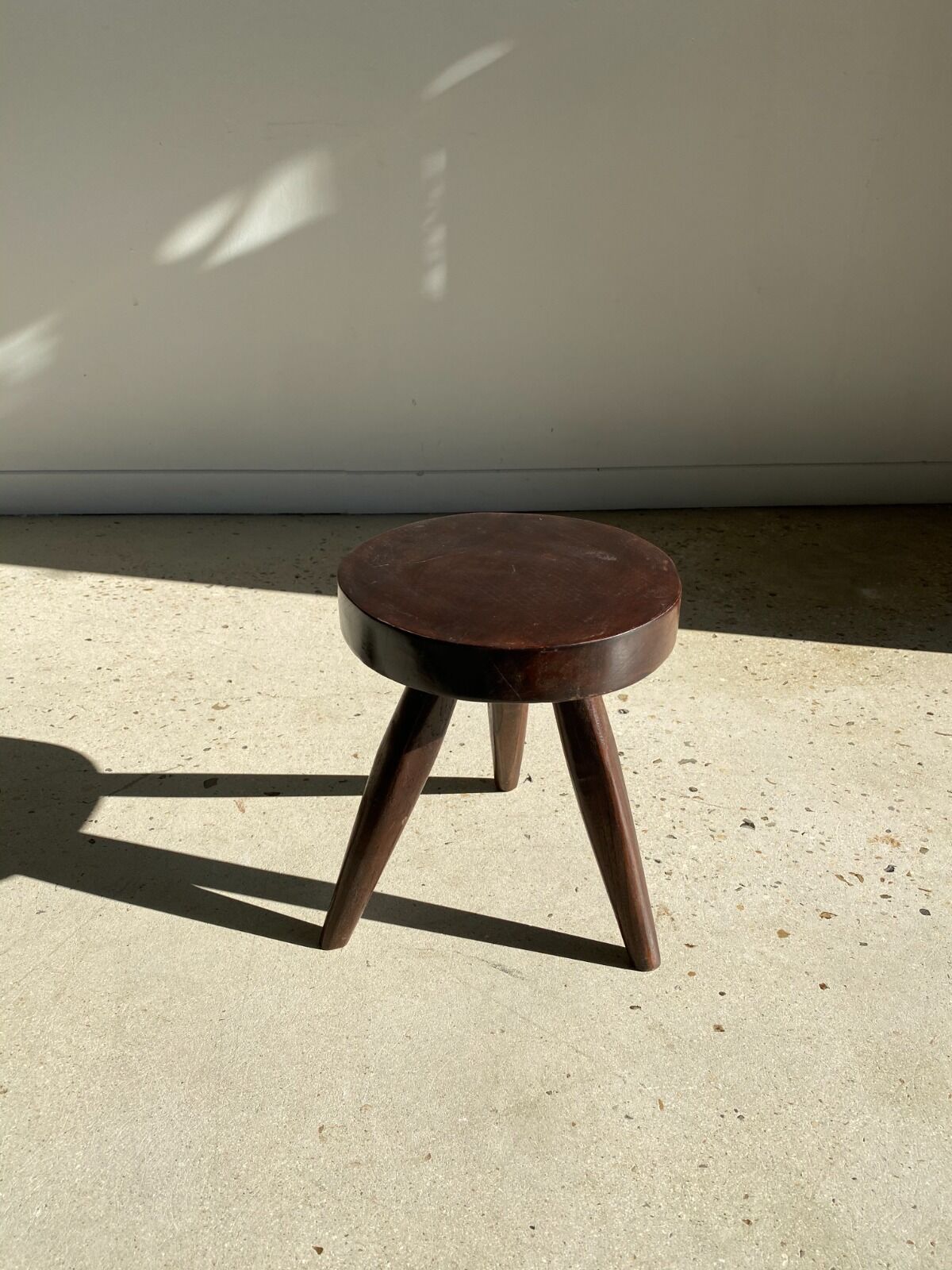 brown solid wood stool flat circular seat
