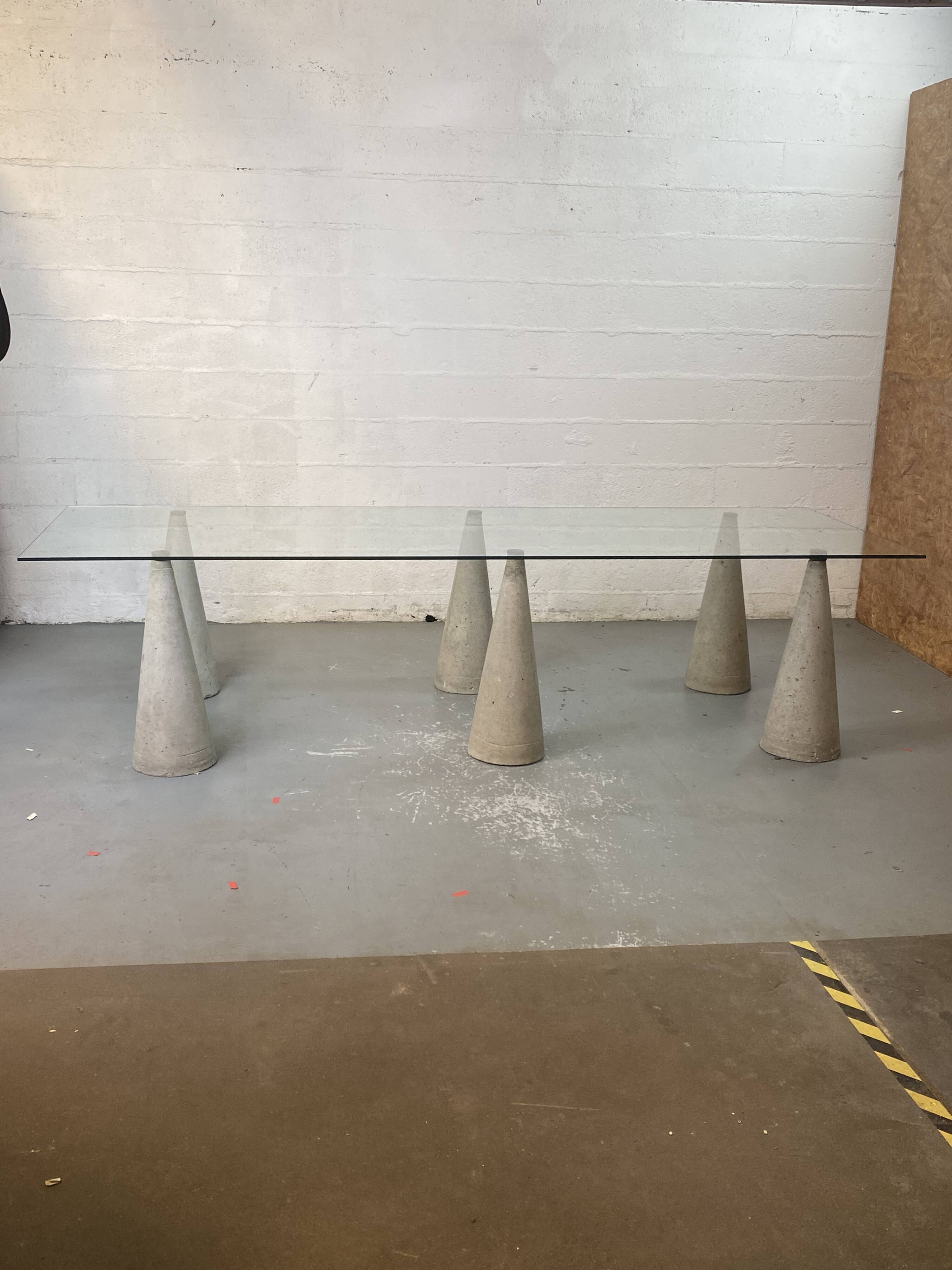 Glass table with cement legs