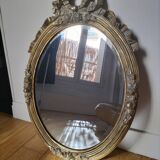 Miroir ovale doré style Louis XVI