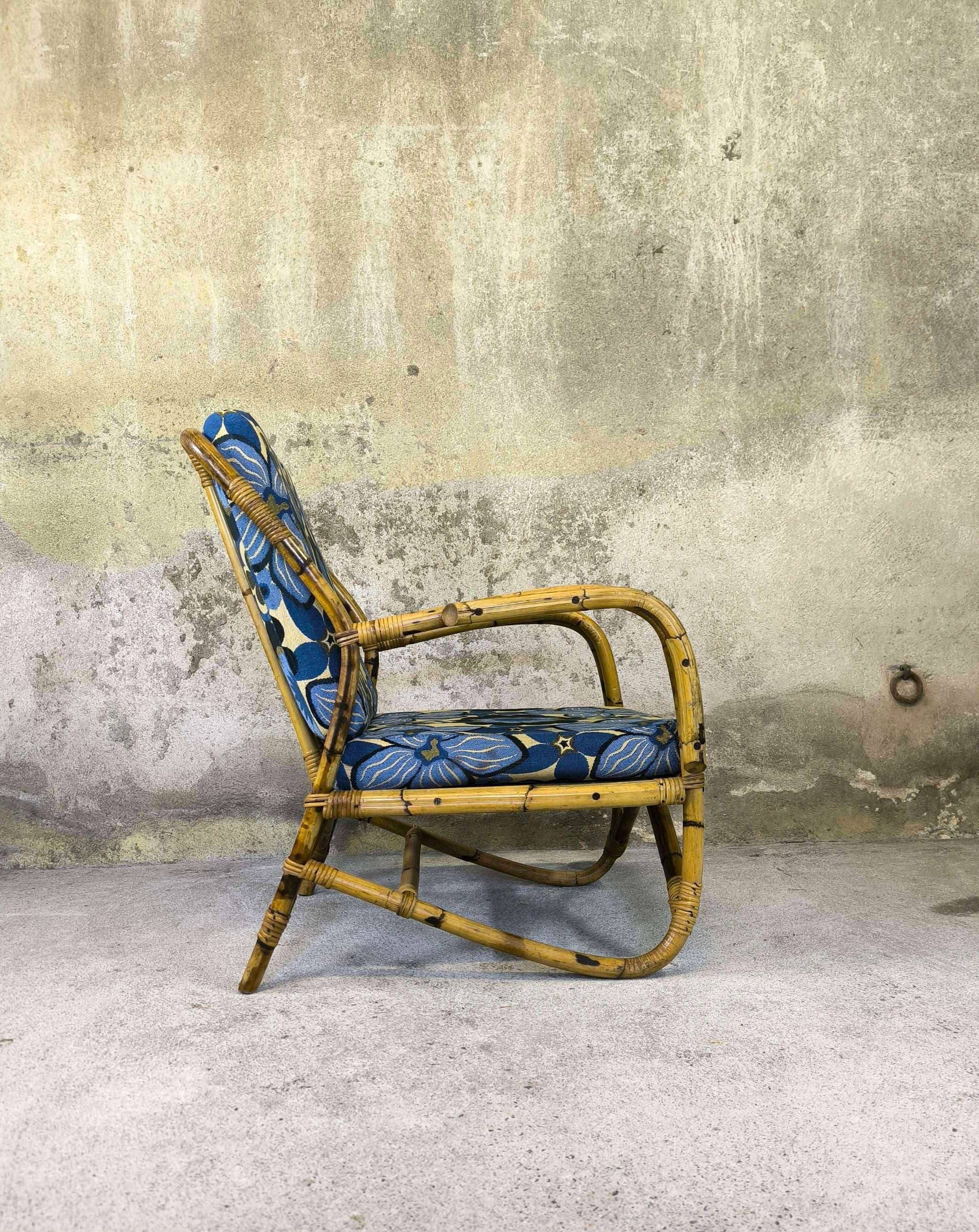 Vintage armchair in rattan and floral fabric