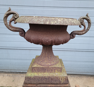 Cast iron garden urn on pedestal with handles