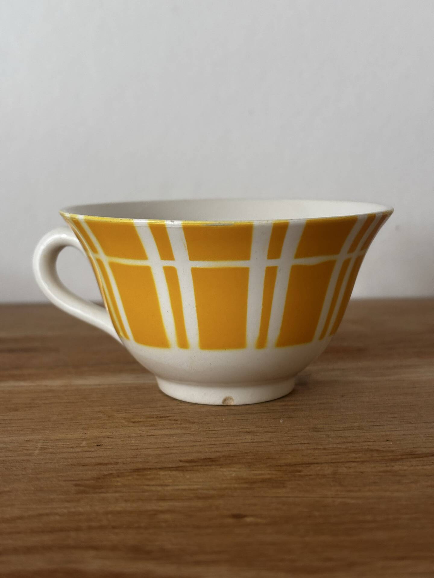 Set of two antique yellow Digoin Sarreguemines cups.