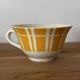Set of two antique yellow Digoin Sarreguemines cups.