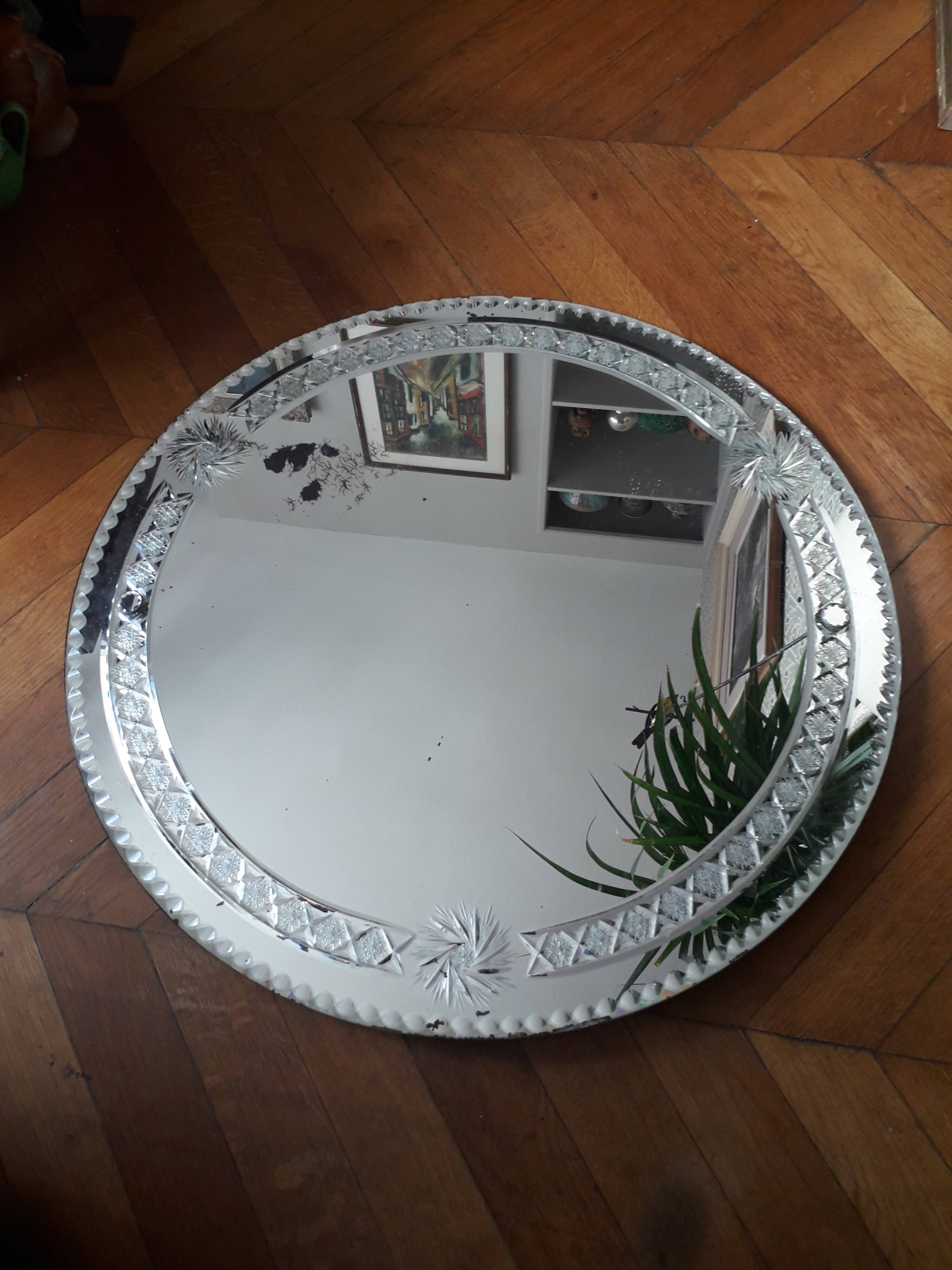 Large old round mirror finely decorated