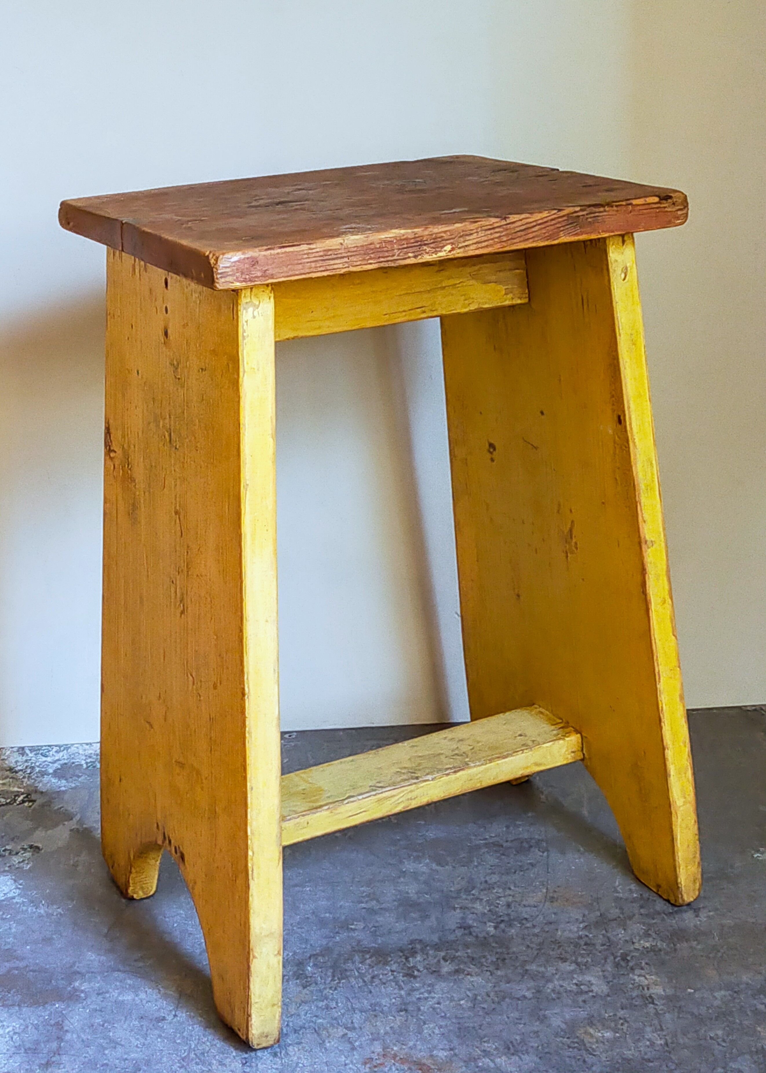 Art-populaire workshop stool in patinated painted wood