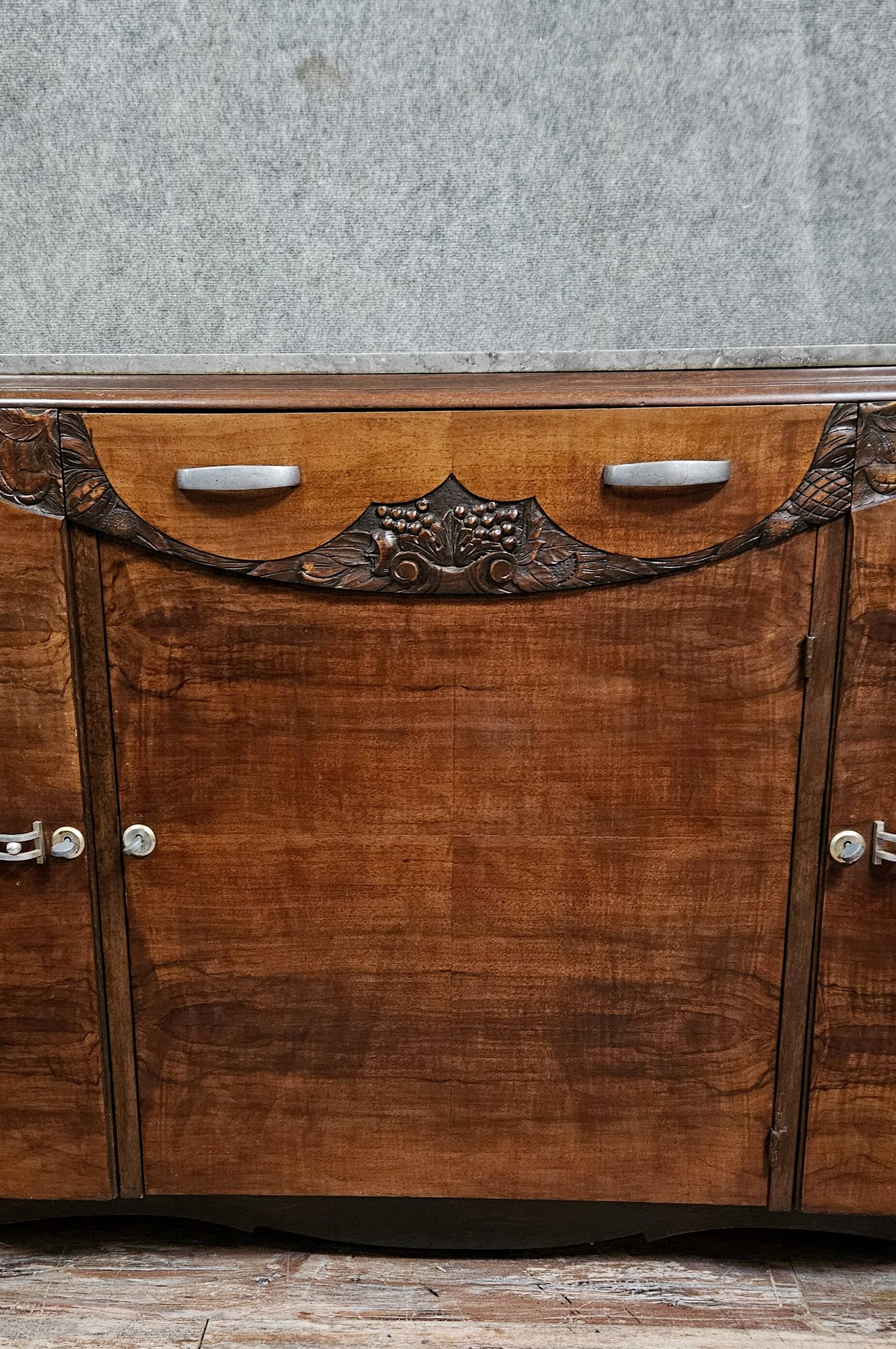 Sideboard in a row, Art Deco period, in mahogany.