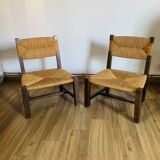 Pair of low wooden and straw armchairs