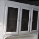 Grey painted pine sideboard with display cabinet and mirror effect glass, early 20th century.