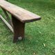 Old solid wood farm bench